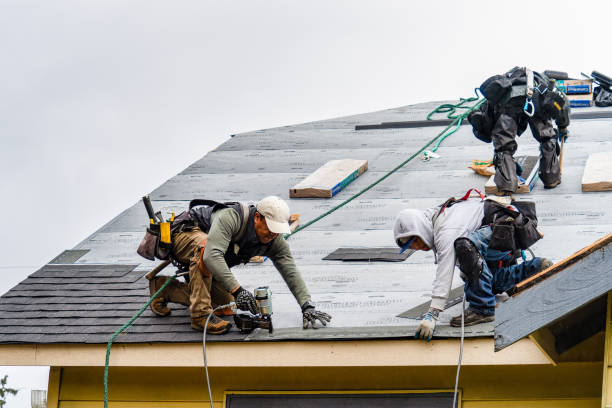 Professional Roofing technician working in Baldwin Place, NY